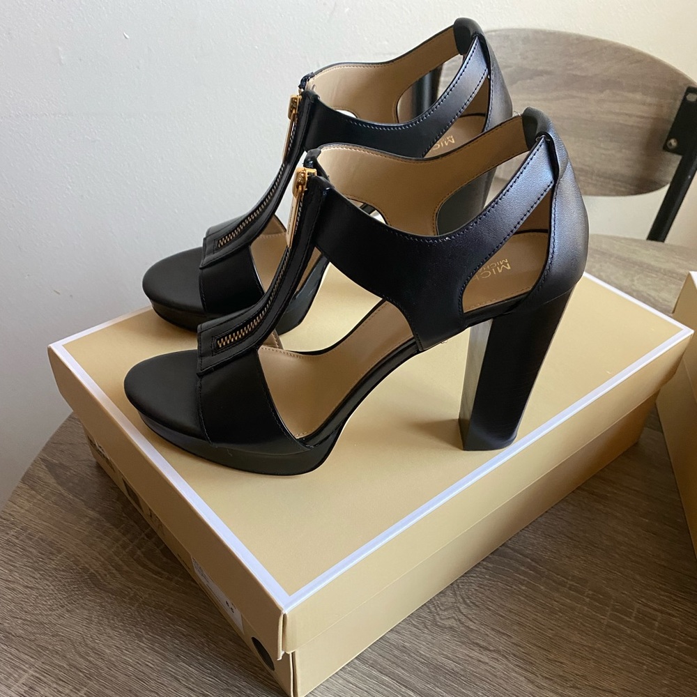 Selling brand new Micheal Kors heels. Size 8 1/2.  Black and brown.